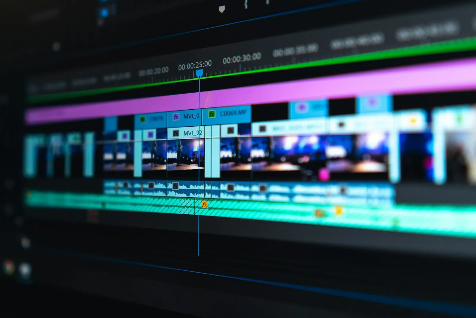 Blurred video editing timeline on a dark screen